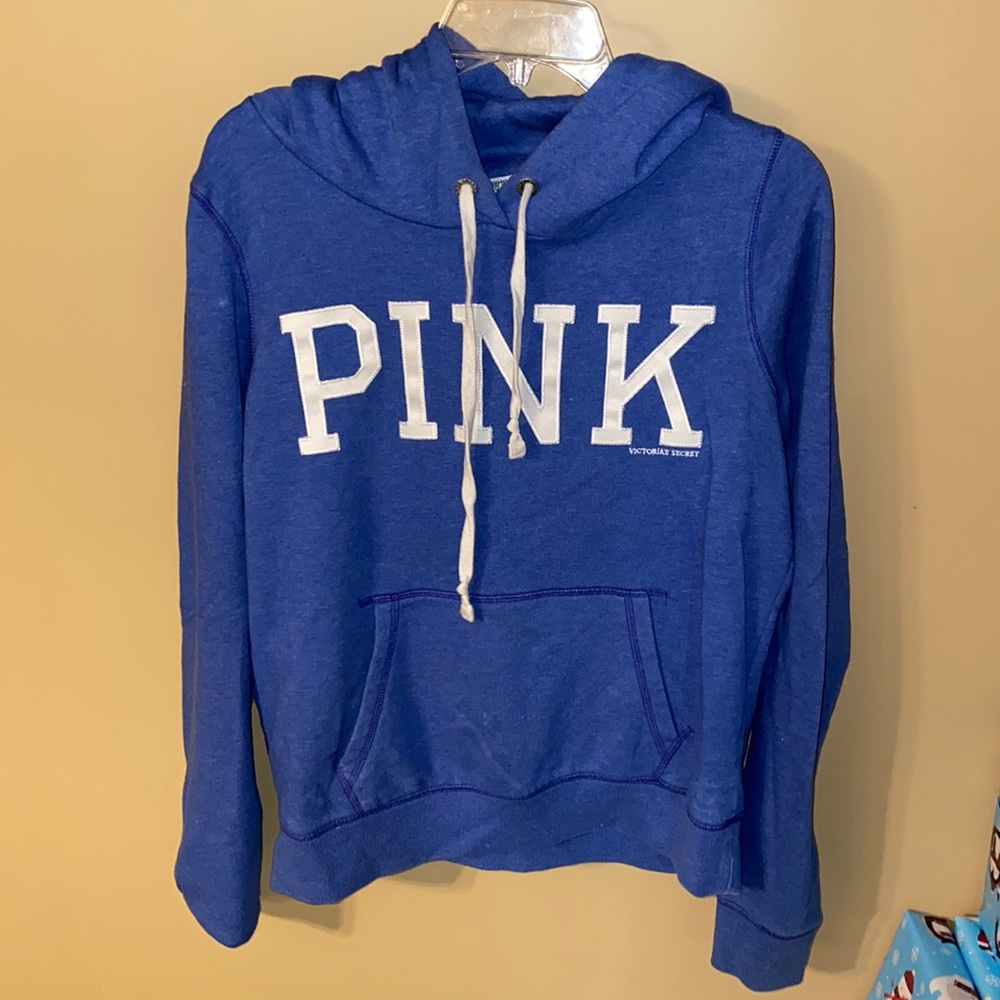 pink sweatshirt.